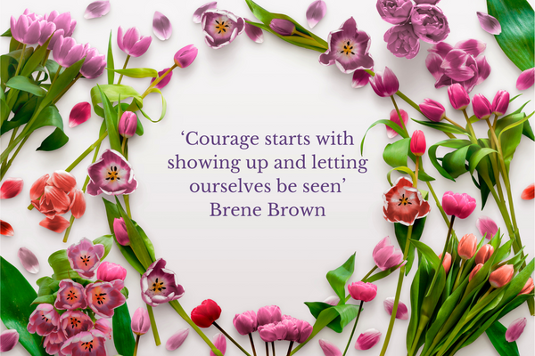 Spring pink flowers and quote ' Courage starts with showing up and letting ourselves be seen' Brene Brown